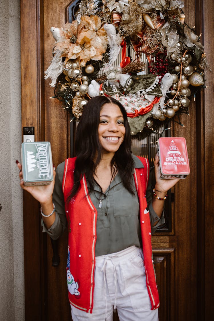 Happy Woman With Christmas Presents In Hands