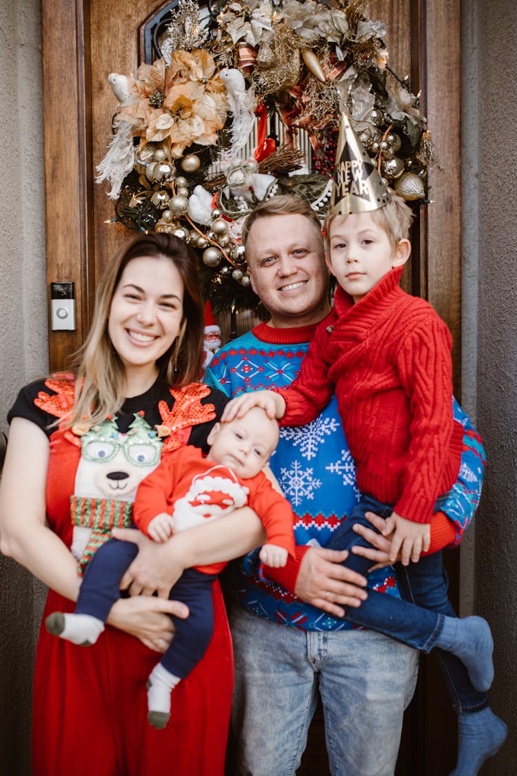 Happy Family Posing Together At Christmas