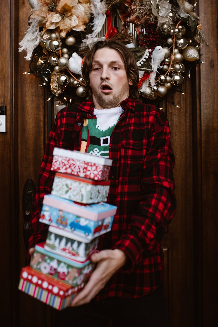 Man Carrying Presents In Boxes