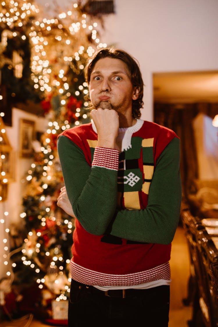 Photo Of Man In Christmas Sweater Doing Funny Face