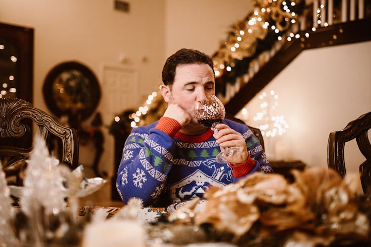 Man Wearing Sweater Drinking Wine