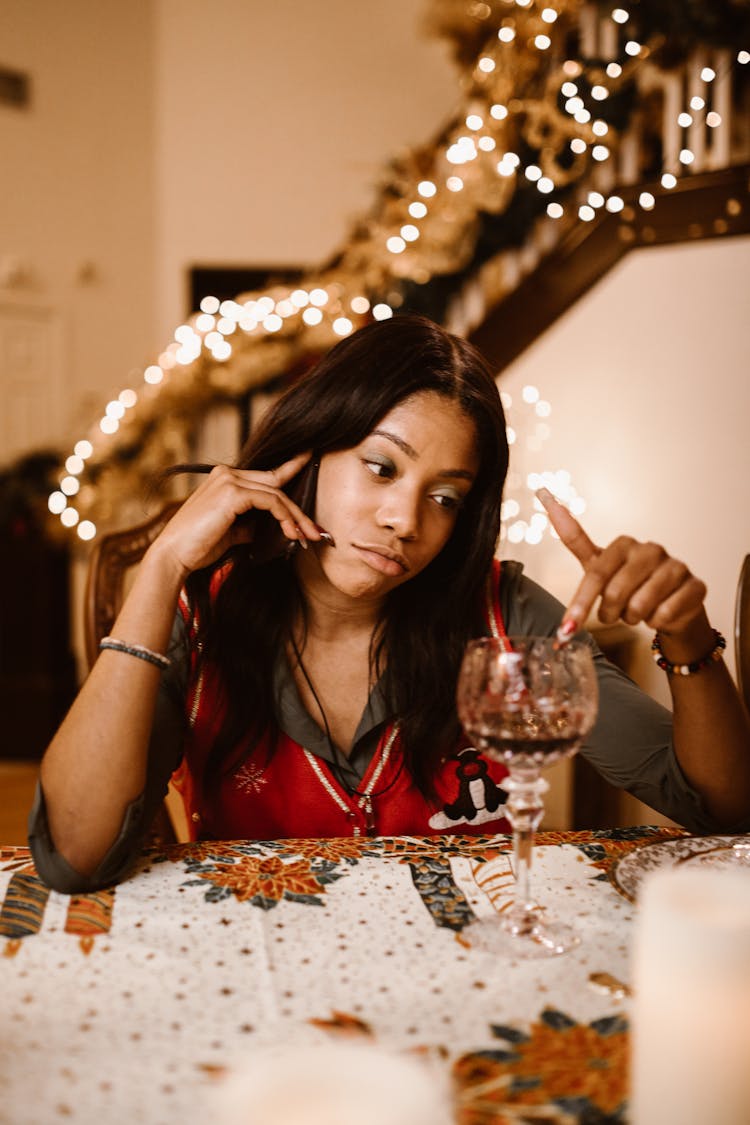 Woman Touching A Wine Glass