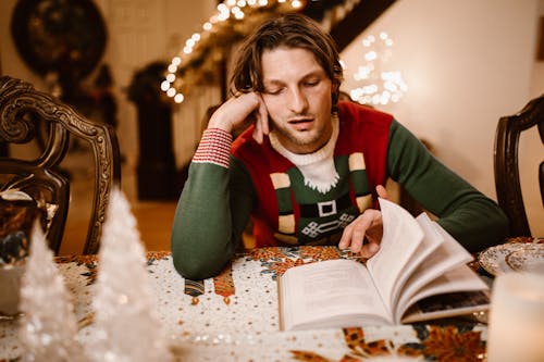 Free A Man Reading a Book Stock Photo