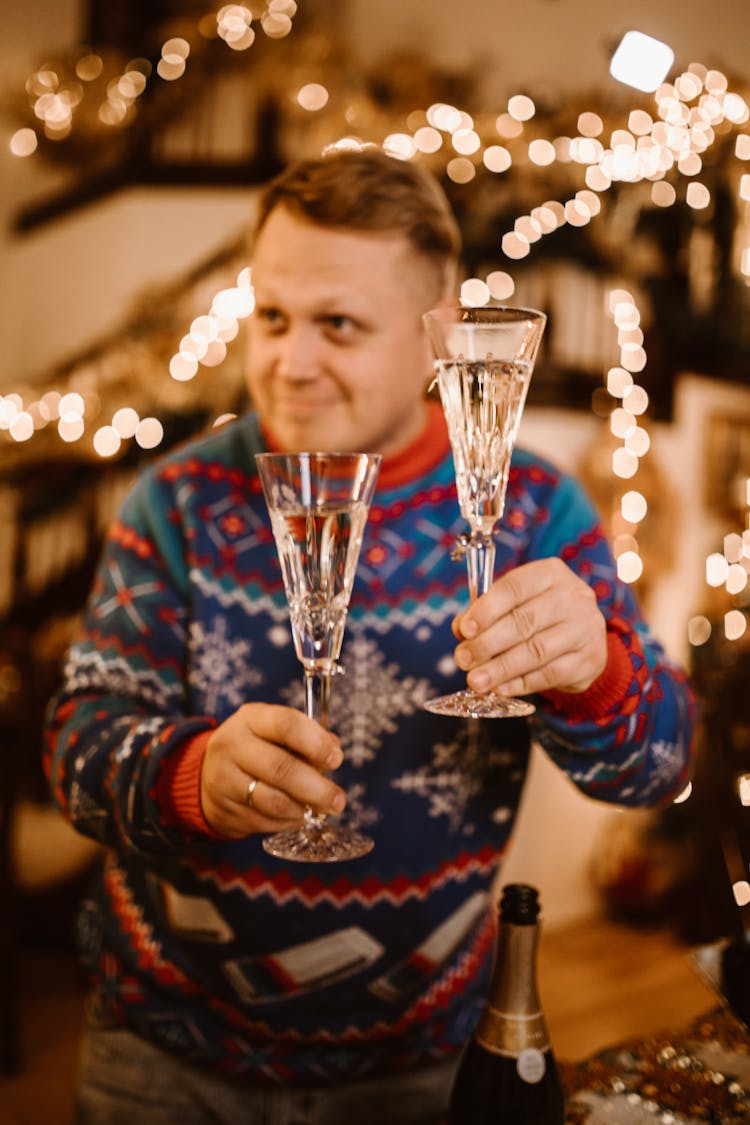 Man Holding Wine Glasses