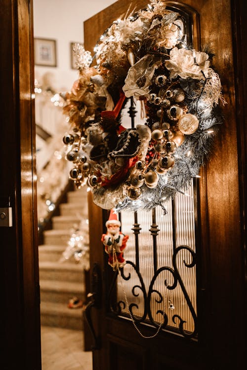 Christmas Wreath Hanging on Wooden Door with Glass Panel