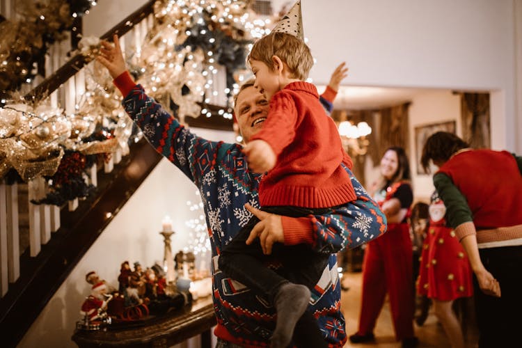 Father Playing With His Little Son On Christmas Eve