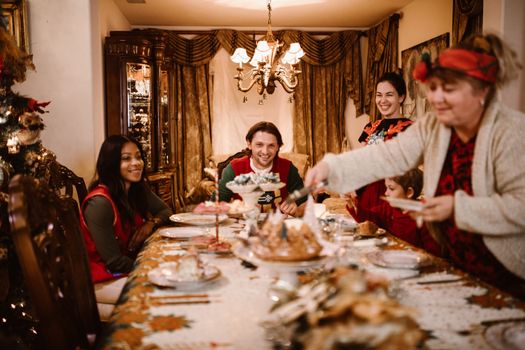 Family enjoying a festive meal together, embracing holiday joy.