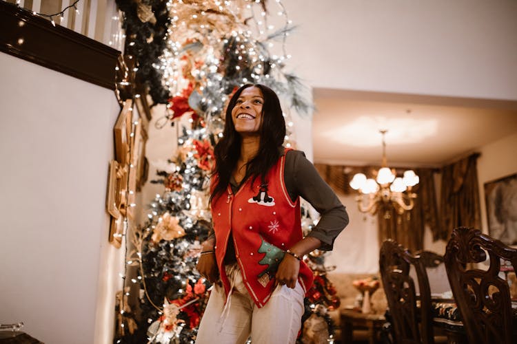 A Woman Wearing A Christmas Vest