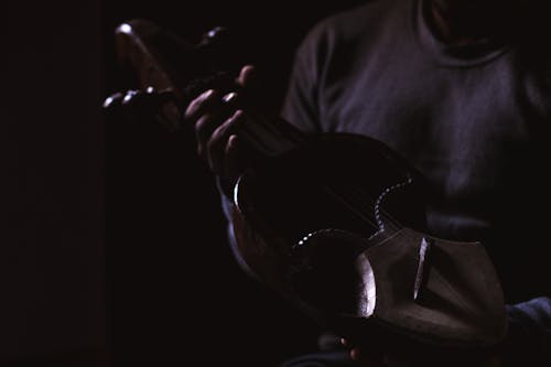 Free stock photo of man playing musical instrument, man playing sarangi, musical instrument Stock Photo