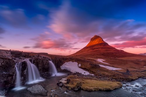 Free Breathtaking view of Kirkjufell mountain and waterfall at sunset in Iceland. Perfect for nature lovers. Stock Photo