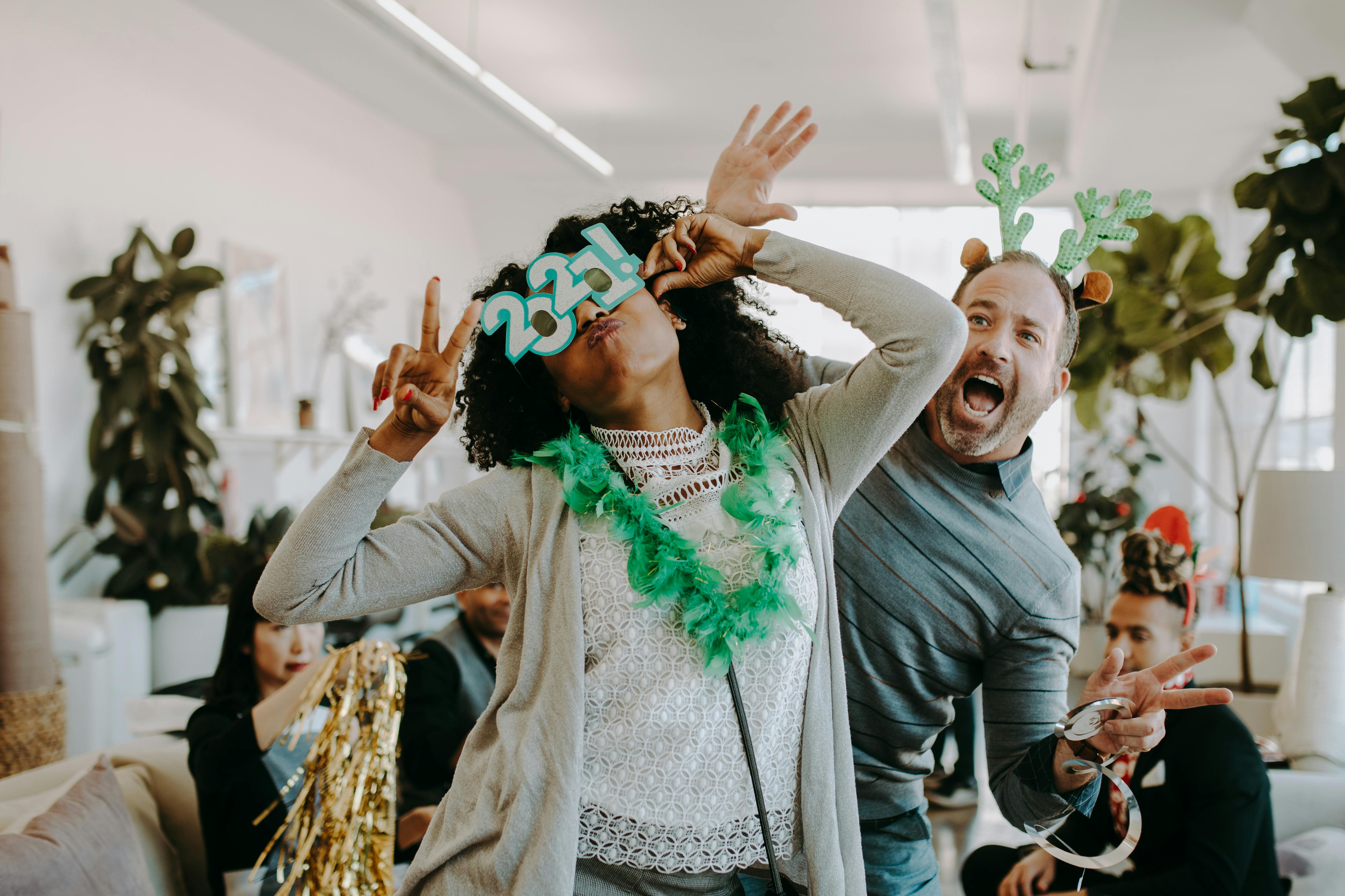 a man and woman having fun at the party