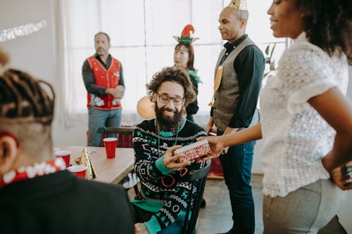 A Woman Giving a Gift to a Man