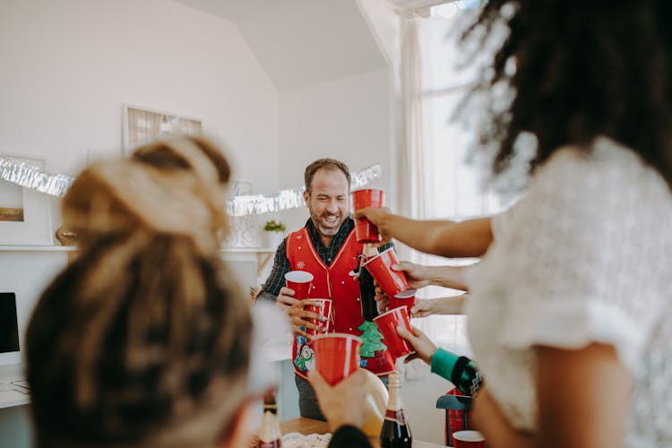 People Toasting Their Red Cups