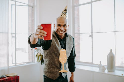 Free A Man Holding a Red Cup Stock Photo