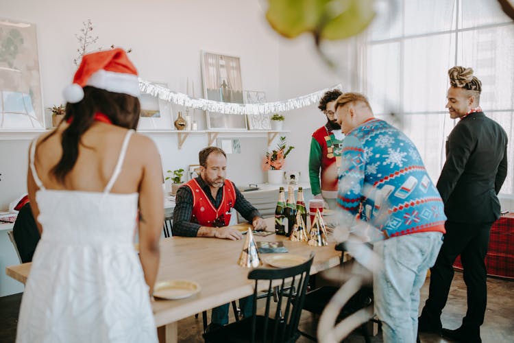 A Group Of Men Having Conversation While Looking At The Table