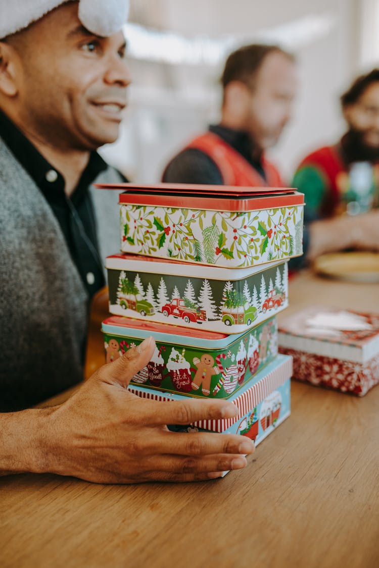 A Man Holding Gifts