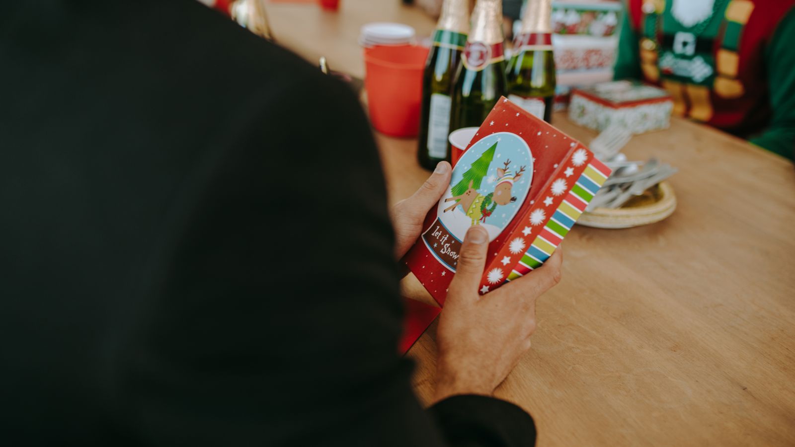 A brightly wrapped present passed between guests at a holiday gathering