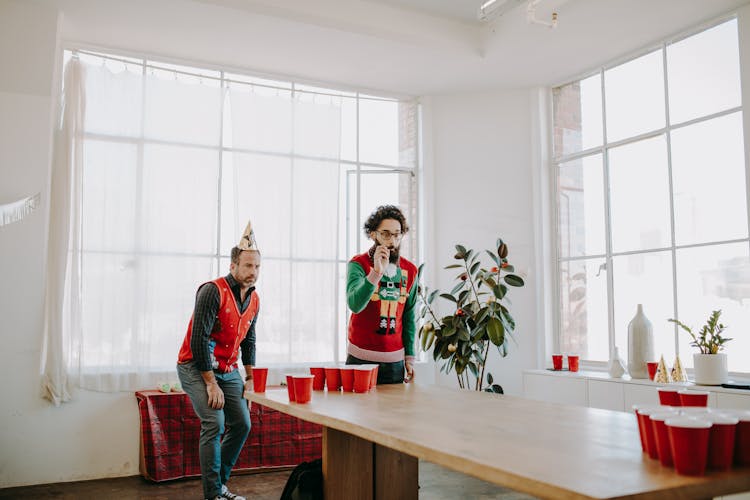 Men Playing Beer Pong