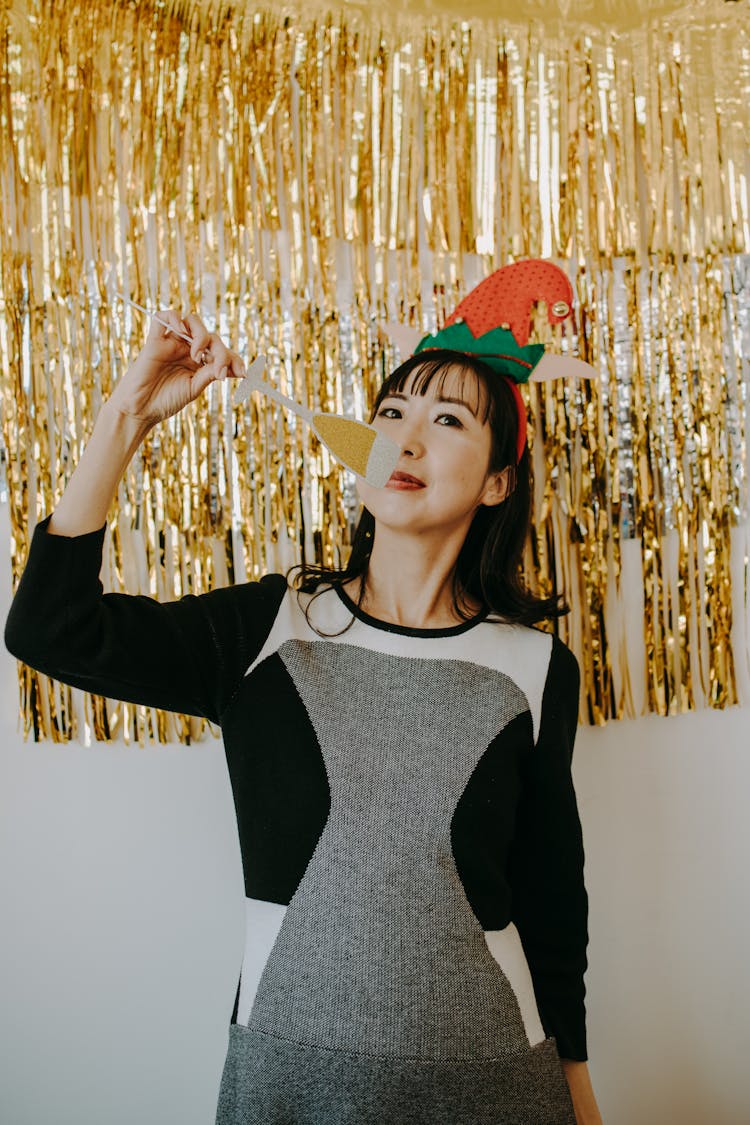 A Woman Celebrating Christmas Holding A Wine Glass Paper Cut Out