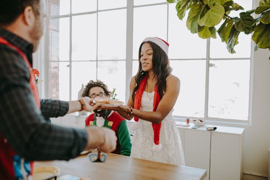 A cheerful Christmas gathering at home with diverse adults and teens in festive attire.