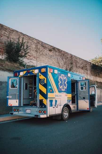 ambulance parked outside building at daytime