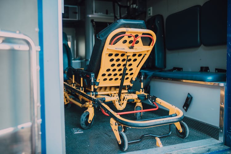 Yellow Stretcher Inside An Ambulance