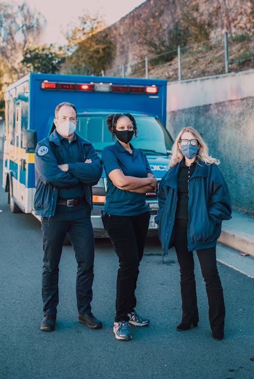 Free Paramedics Standing In Front of an Ambulance Stock Photo