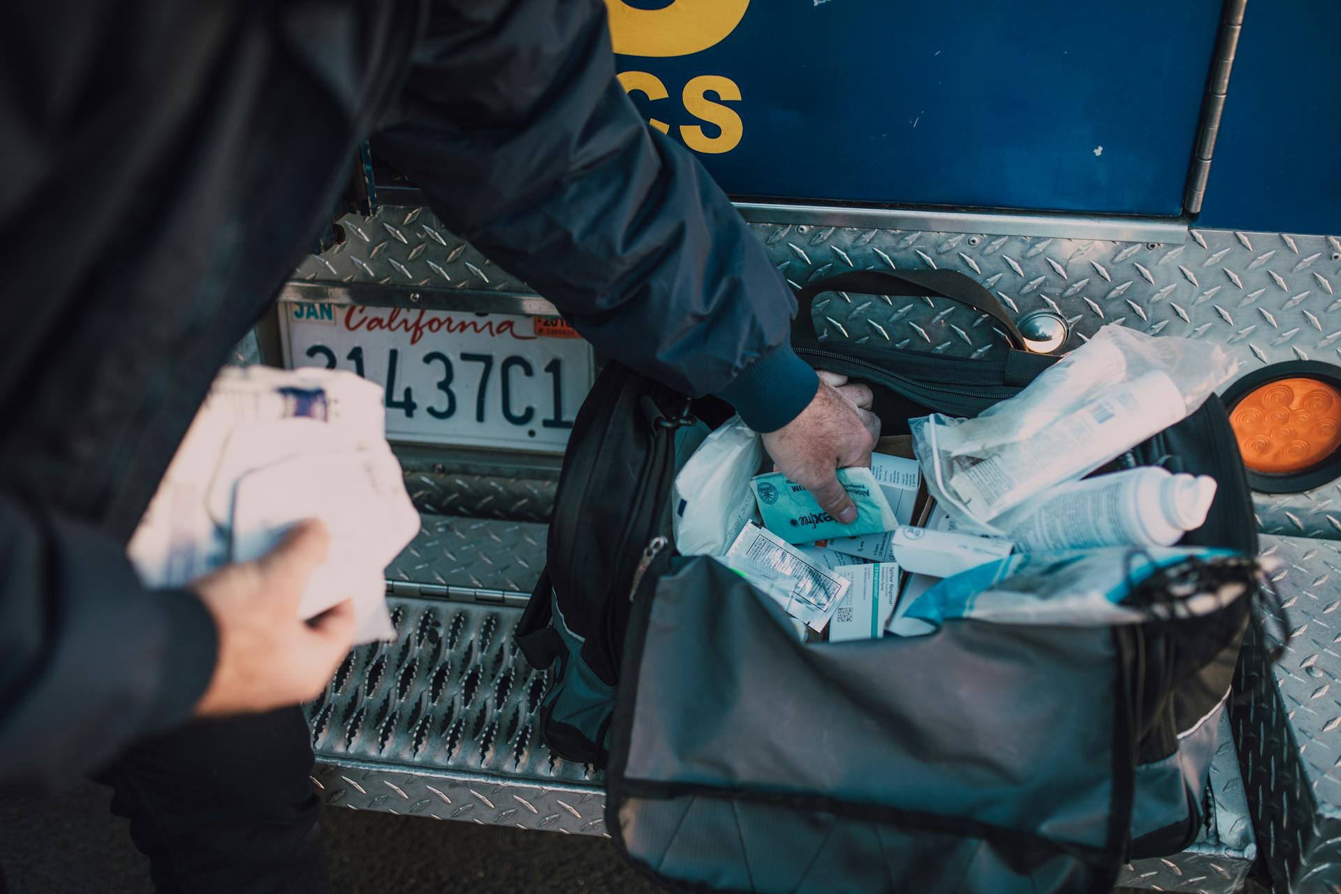 Person Getting Medical Supplies from a Bag