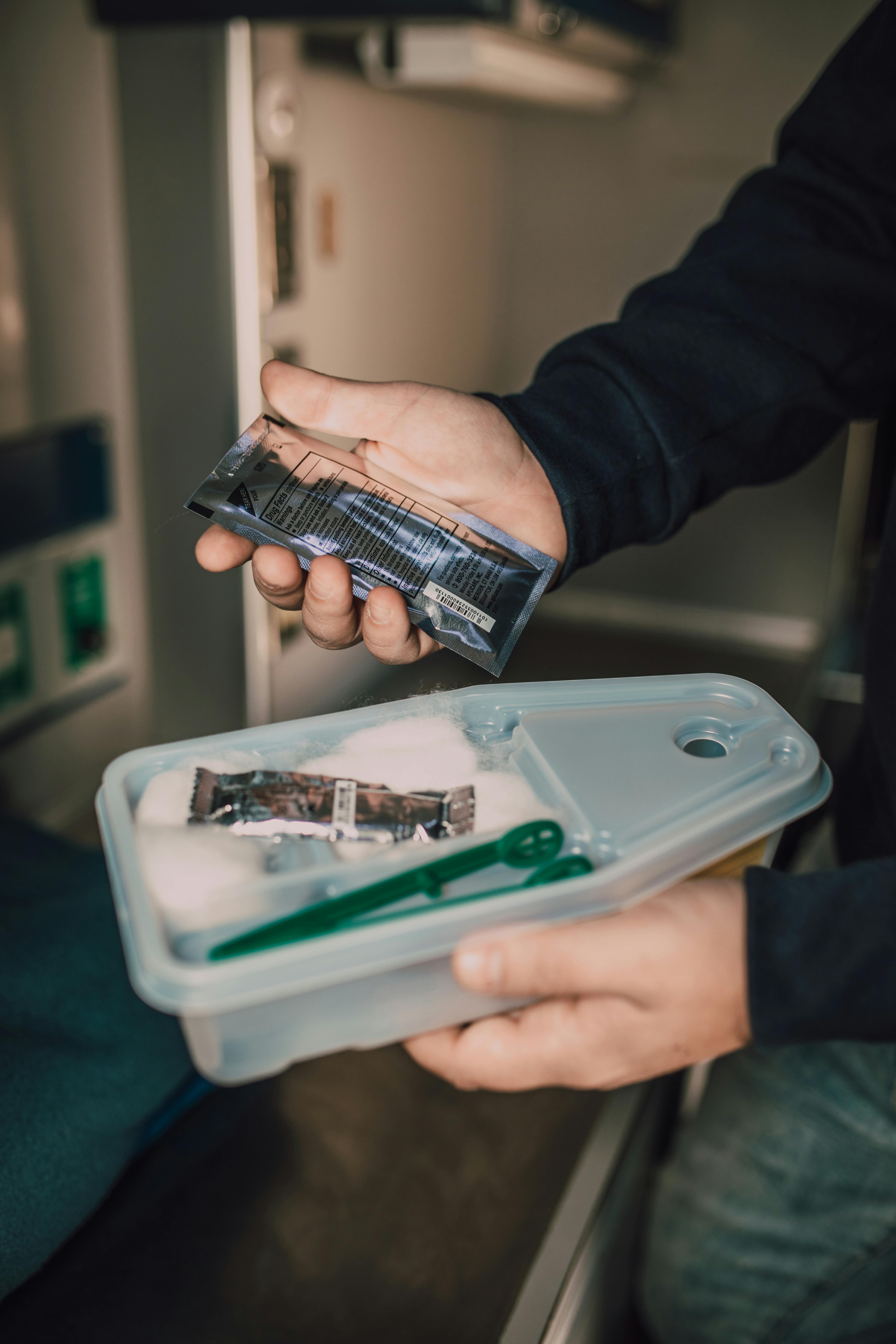 man holding medical supplies