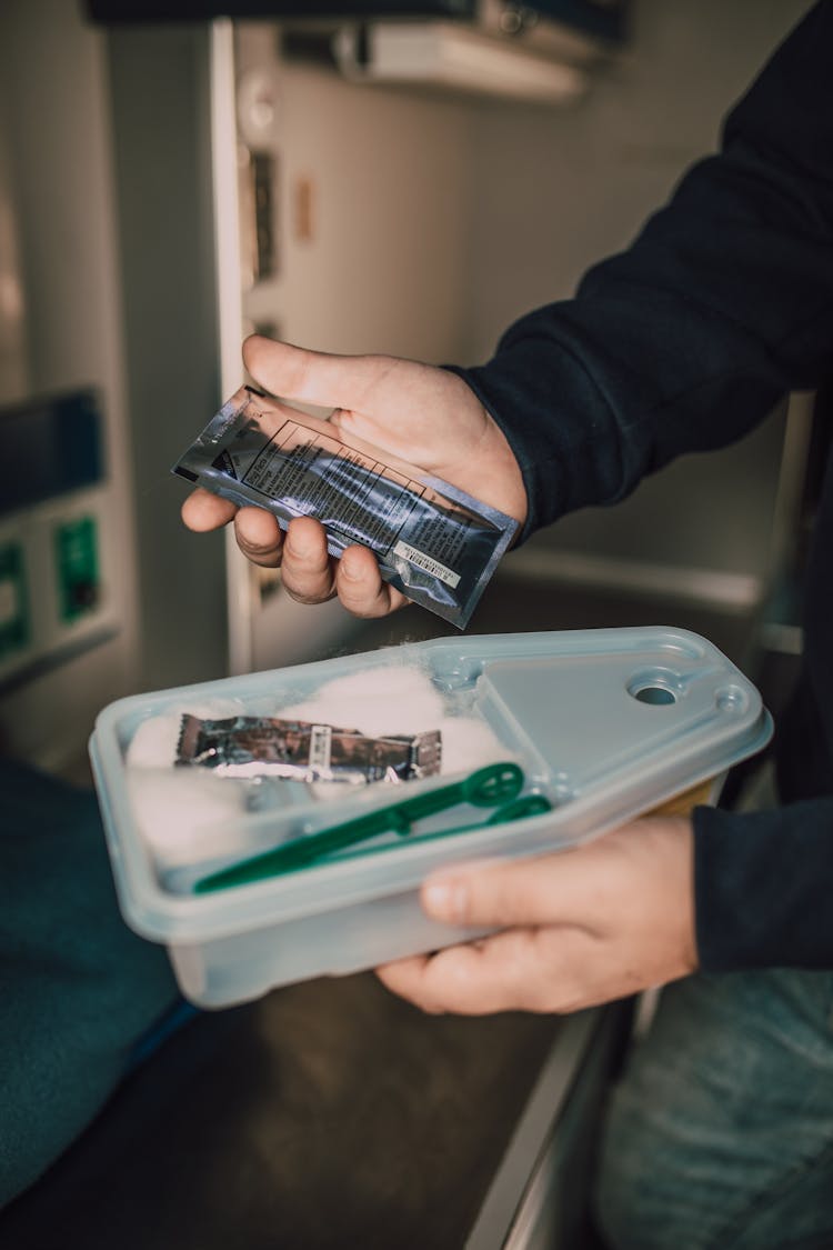 Man Holding Medical Supplies