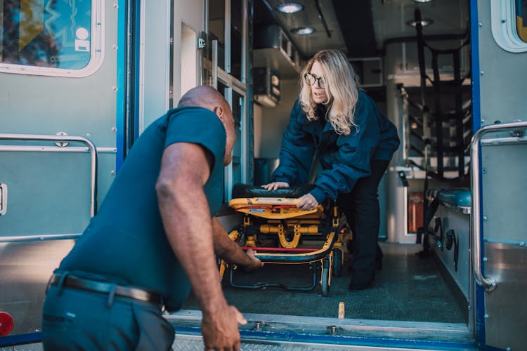 Man Pulling Out A Stretcher