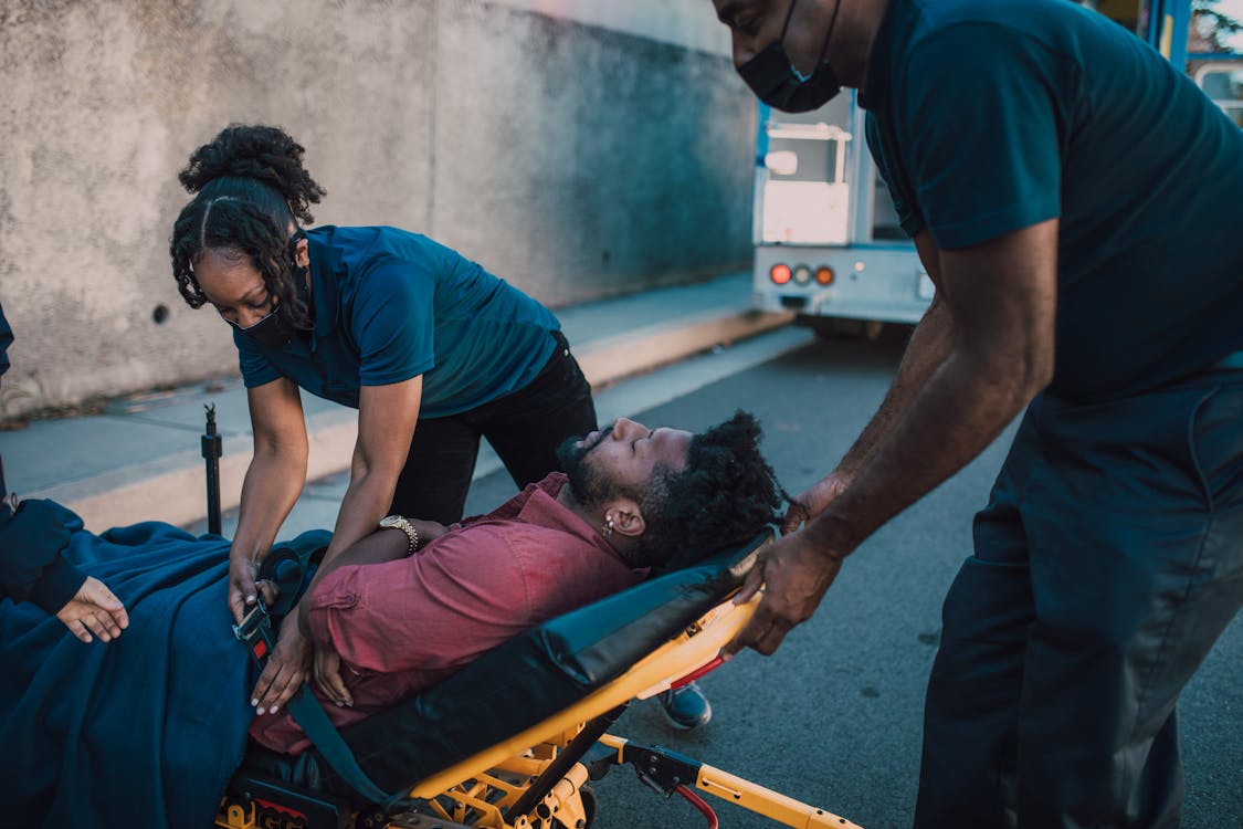 Free Paramedics Rescuing a Man Stock Photo