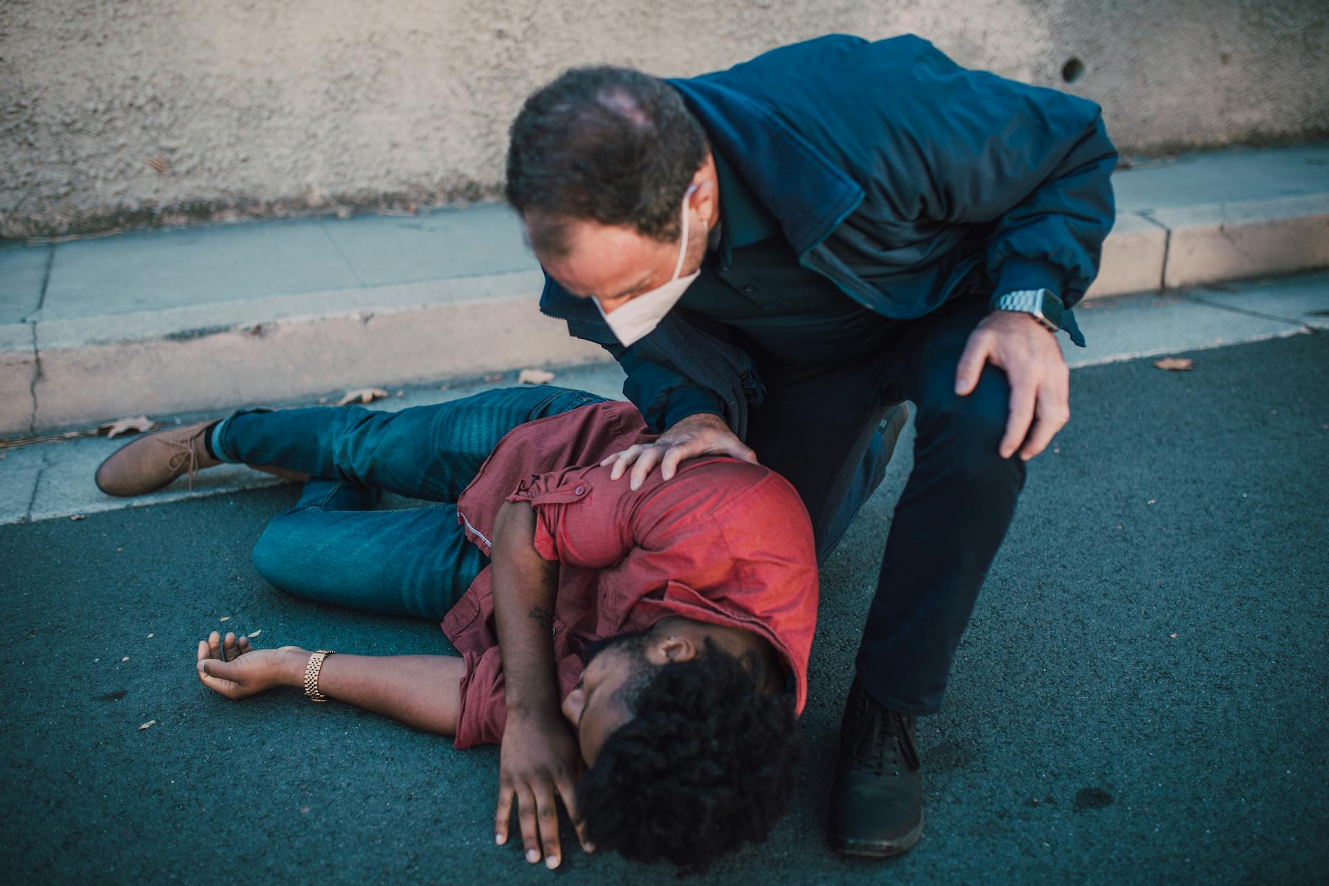 Paramedic Checking on a Man