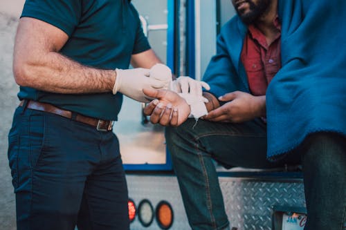 Free Paramedic Administering First Aid Stock Photo