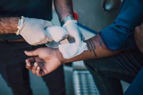 Free Person With White Bandage on Left Hand Stock Photo