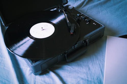 Black Vinyl Record Player on Blue Textile