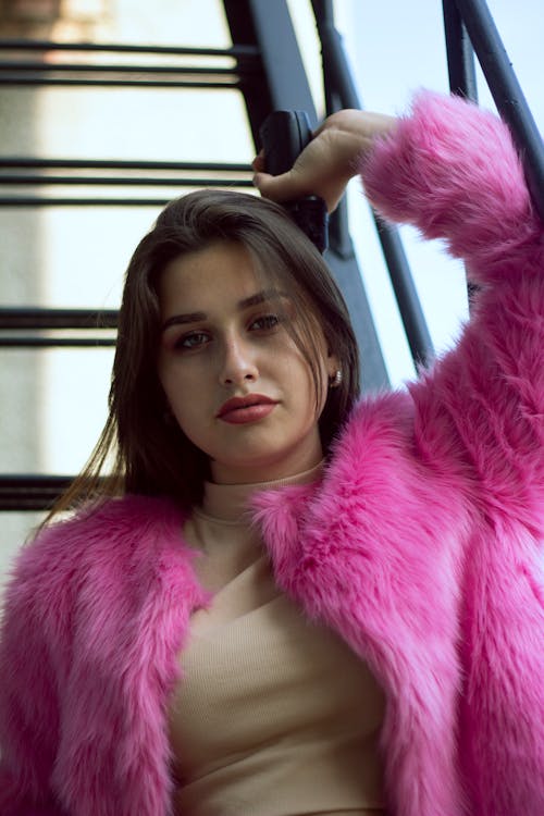 A Pretty Woman in Pink Fur Coat