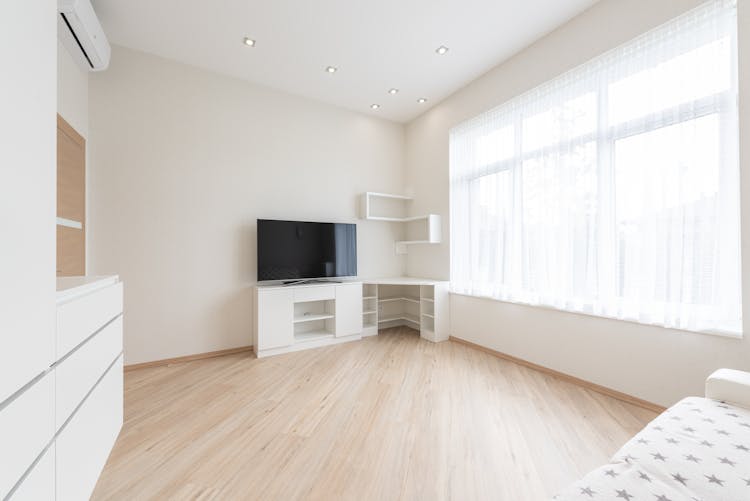 Spacious Living Room With TV Set