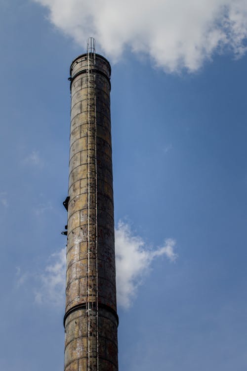 Low Angle Shot of Rusty Smokestack 