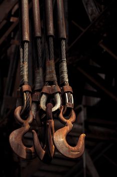 Close-up of rusted industrial hooks in an abandoned Bethlehem Steel site, PA.