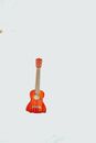 Acoustic guitar in snowy misty terrain