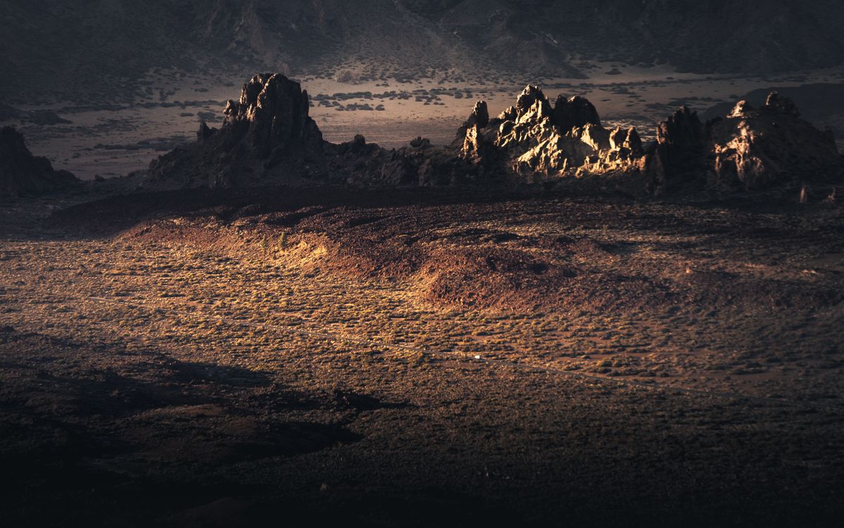 Dramatic geological formations under warm light in Tenerife's arid wilderness., by Marek Piwnicki on Pexels