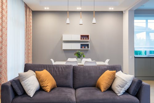 Comfortable couch near table in apartment