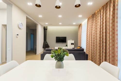 Free Stylish apartment with table near sofa Stock Photo