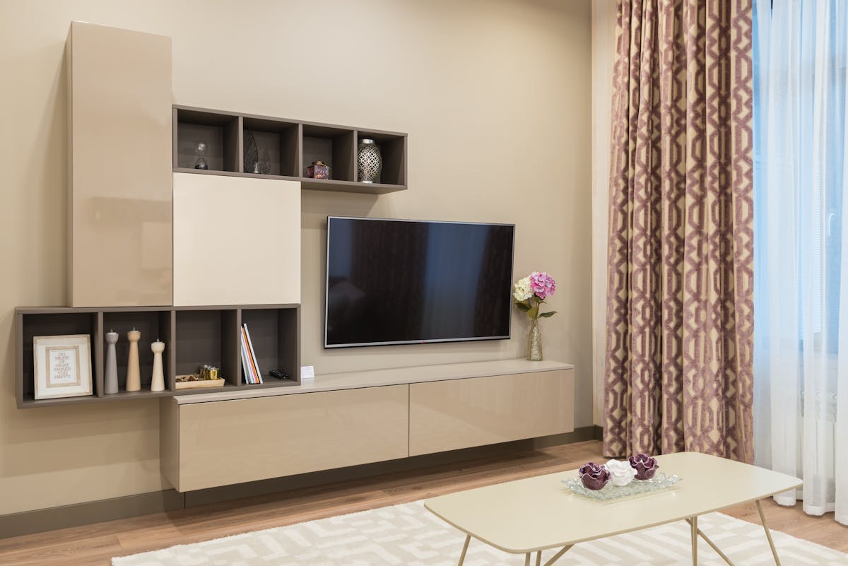Modern furniture and TV set in cozy living room