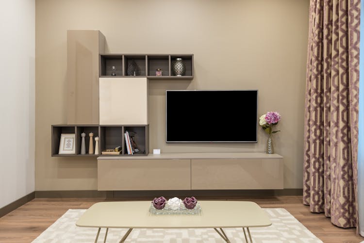 TV Set And Minimalist Furniture In Modern Apartment