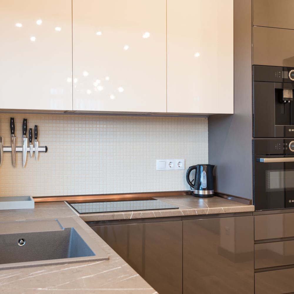 Kitchen Spraying in Dollis Hill — careful masking before painting begins