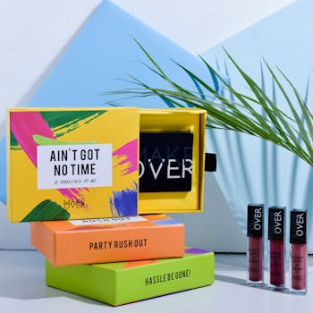 Vibrant cosmetic products with lipsticks on display, featuring colorful packaging.