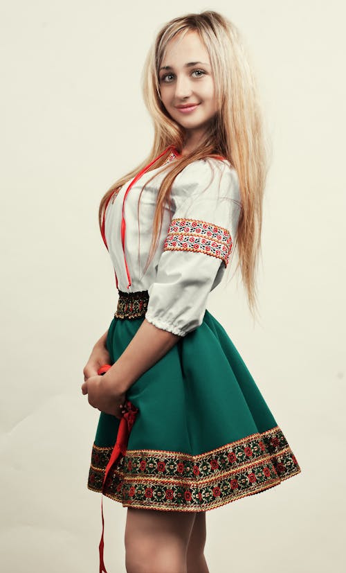Beautiful Woman in White Blouse and Green Skirt 
