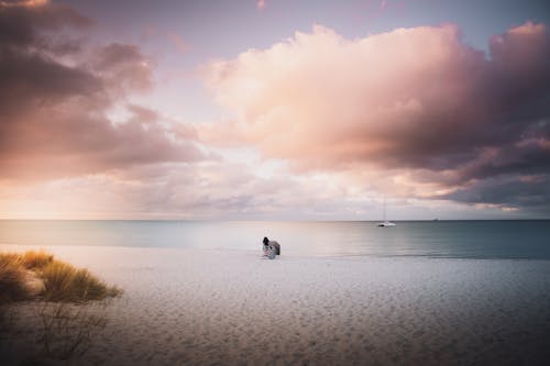 Free Person resting on Beachside  Stock Photo